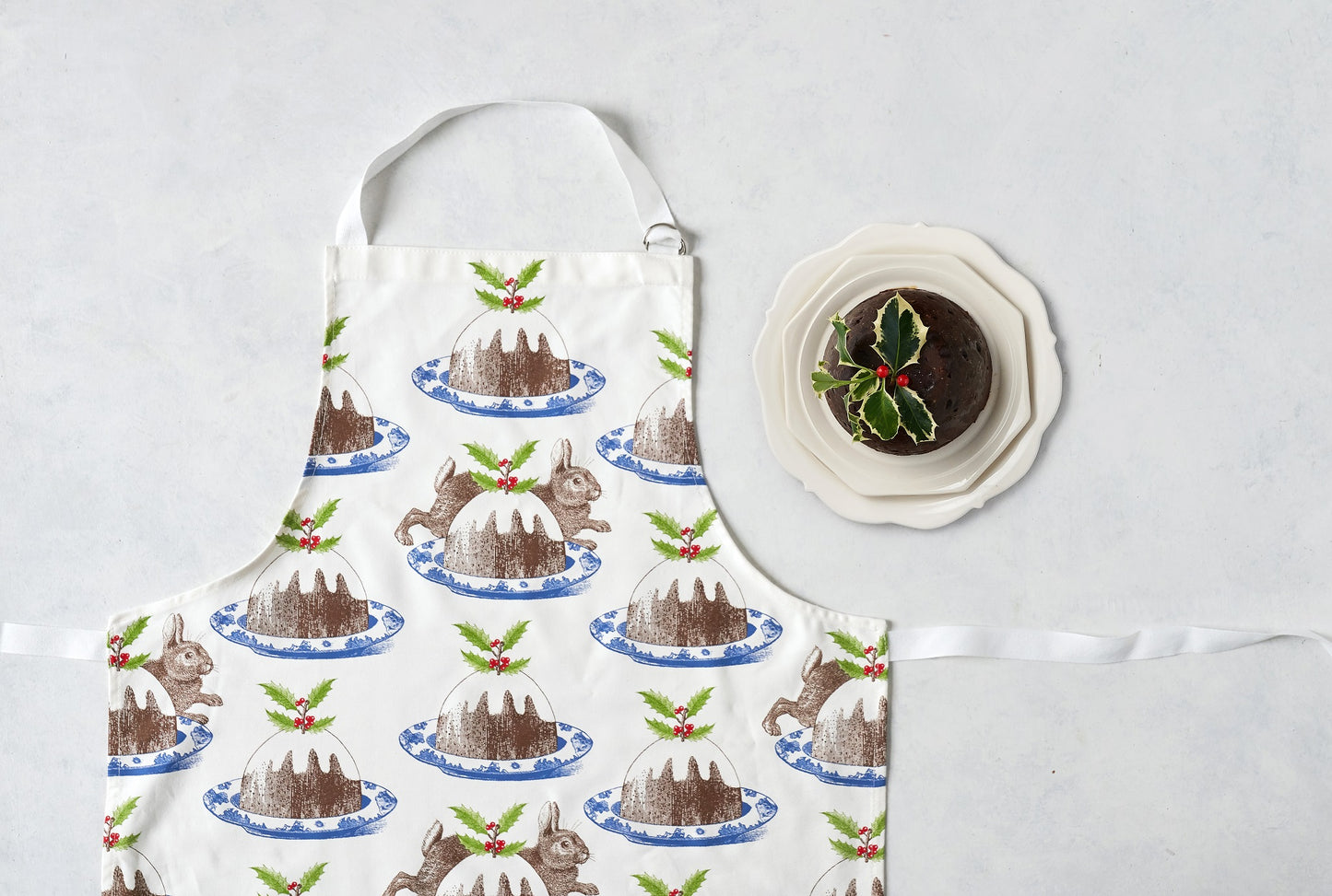 kitchentins - Thornback & Peel cotton apron printed with rabbit and pudding design with adjustable neck strap.