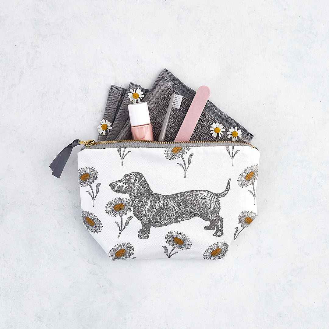 Kitchentins - Thornback and Peel small cosmetic bag printed with grey daschunds and grey and yellow daisies.