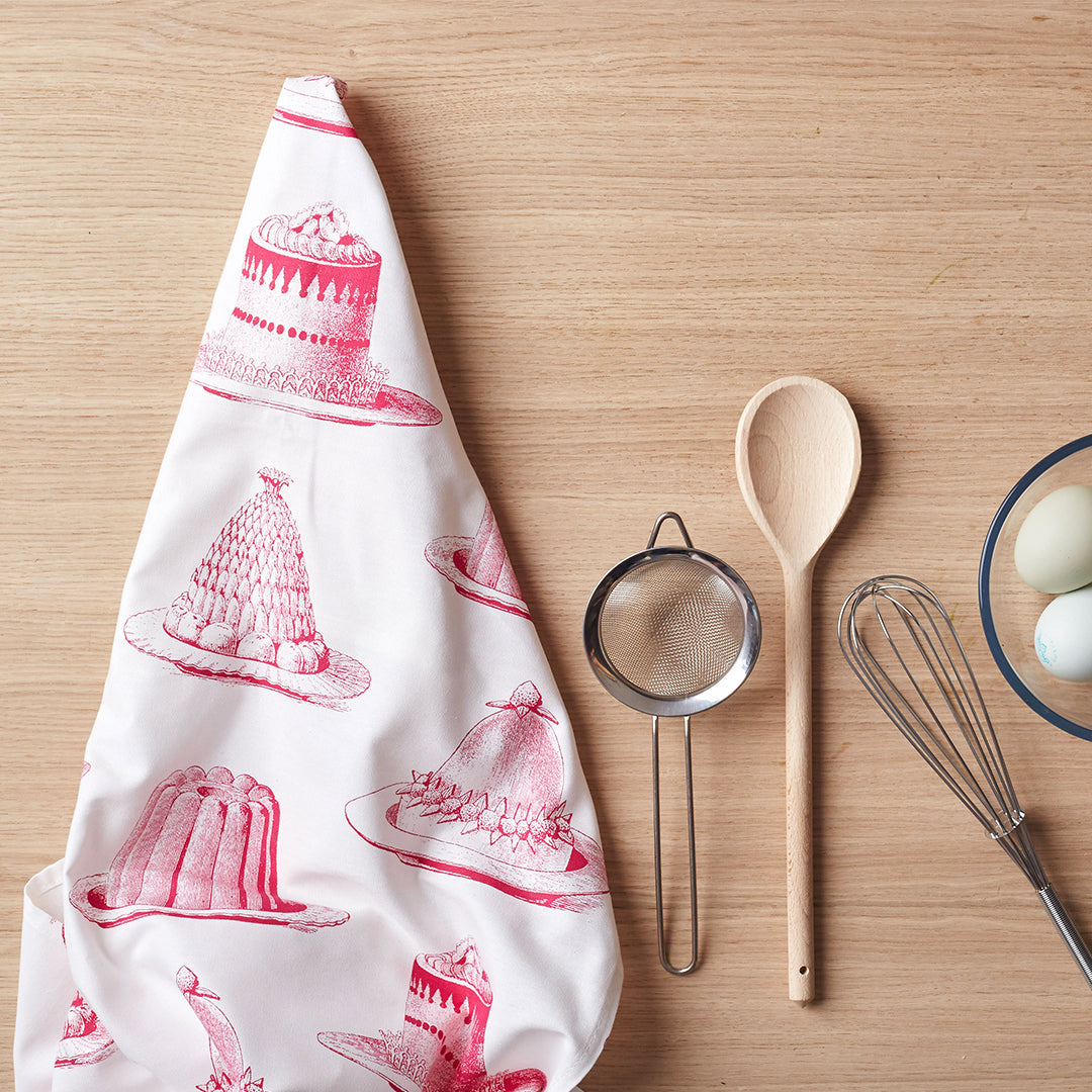 Kitchentins - Thornback & Peel cotton tea towel printed with raspberry pink jellies and cakes