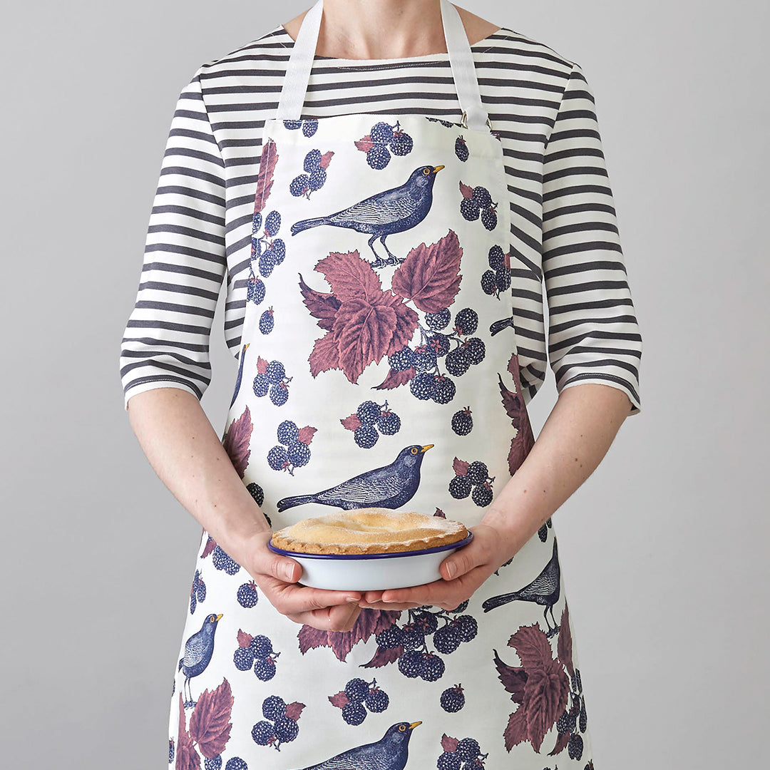 kitchentins - Thornback & Peel cotton apron printed with purple blackbird and bramble design with adjustable neck strap.