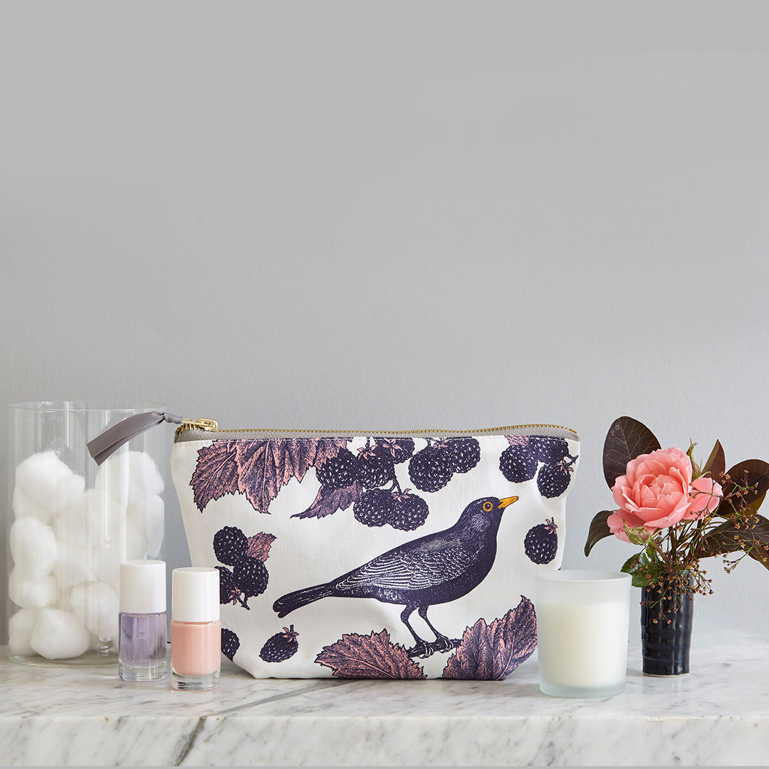 Kitchentins - Thornback and Peel small cosmetic bag printed in purple tones in the blackbird and bramble design.