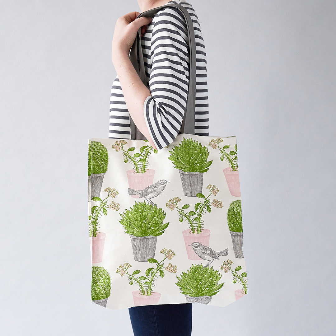 kitchentins - Thornback and Peel Cotton tote bags printed with pink and green succulents with a little bird hopping around.