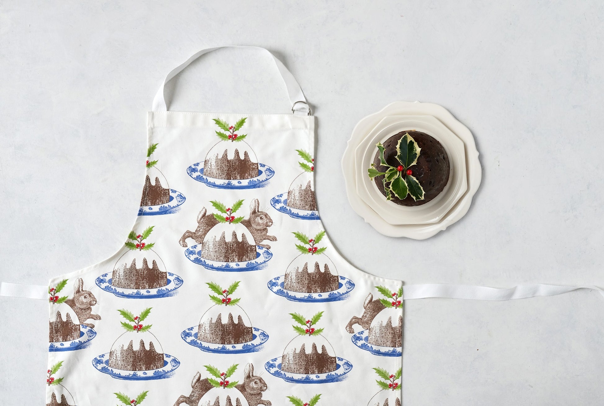 kitchentins - Thornback & Peel cotton apron printed with rabbit and pudding design with adjustable neck strap.
