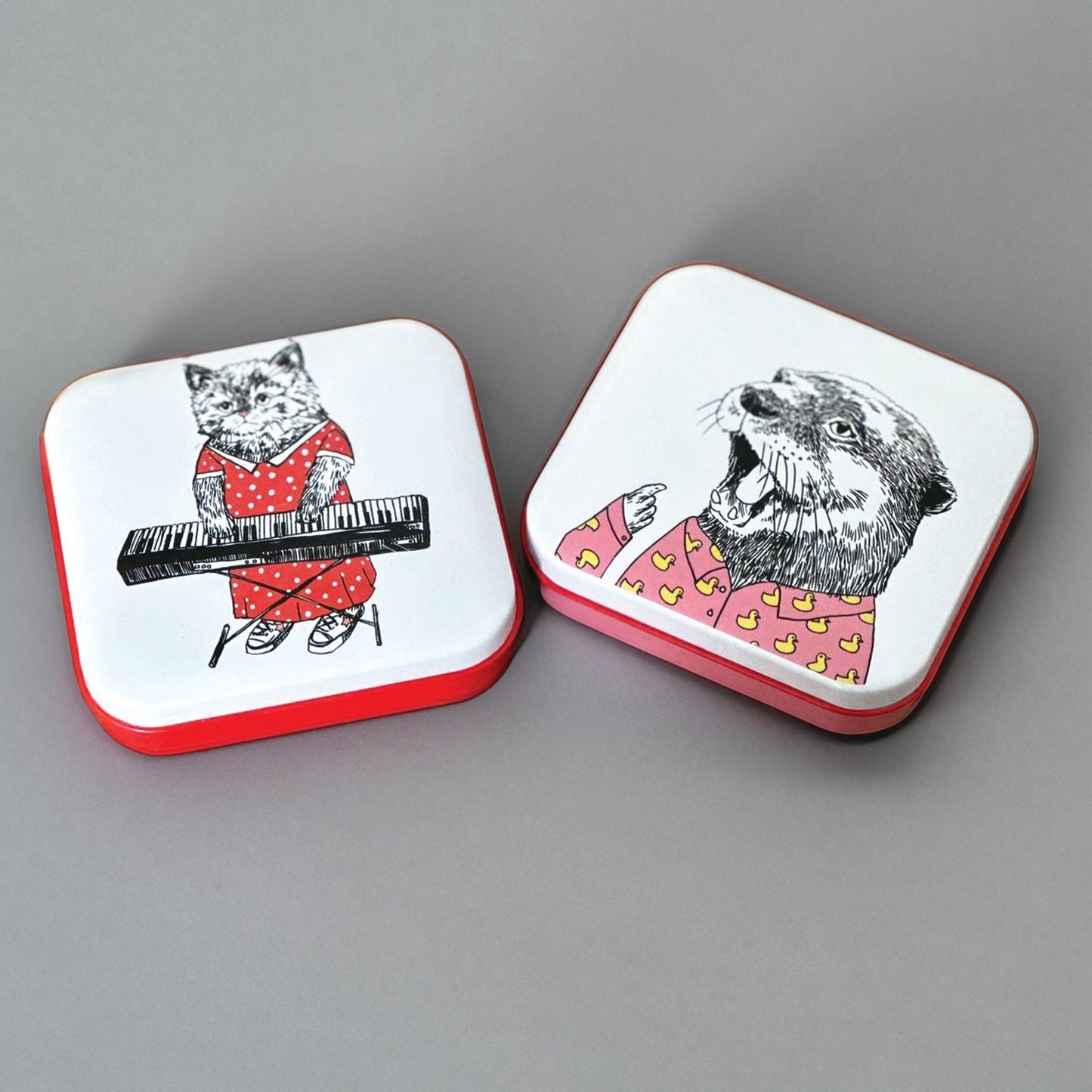 kitchentins- set of two pocket tins, one with a cat playing the piano and one with a hungry otter