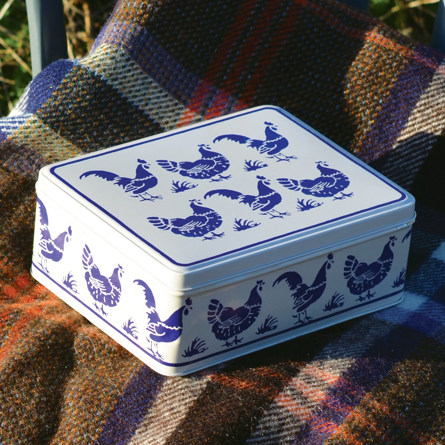 Kitchentins - Emma Bridgewater Rectangular Blue Hens Tin with blue bird design on a plaid fabric background