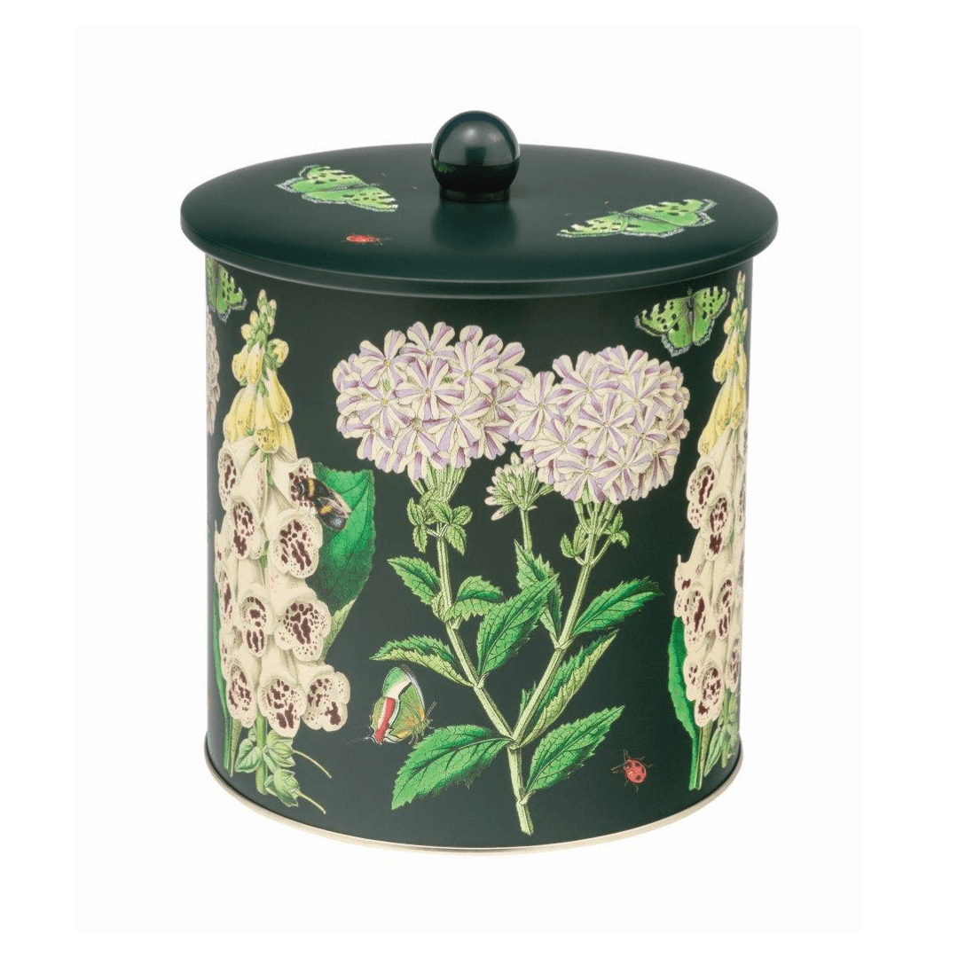 kitchentins - Madame Treacle biscuit barrel with a floral design on a dark green background.