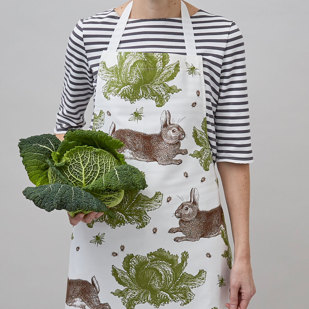 kitchentins - Thornback & Peel cotton apron printed with brown and green rabbit and cabbage design with adjustable neck strap.