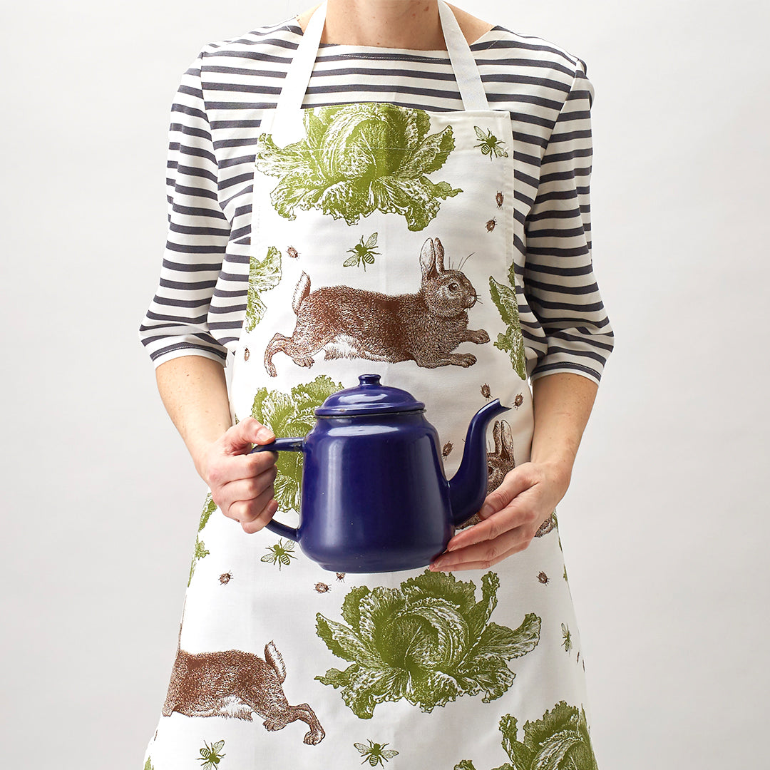 kitchentins - Thornback & Peel cotton apron printed with brown and green rabbit and cabbage design with adjustable neck strap.