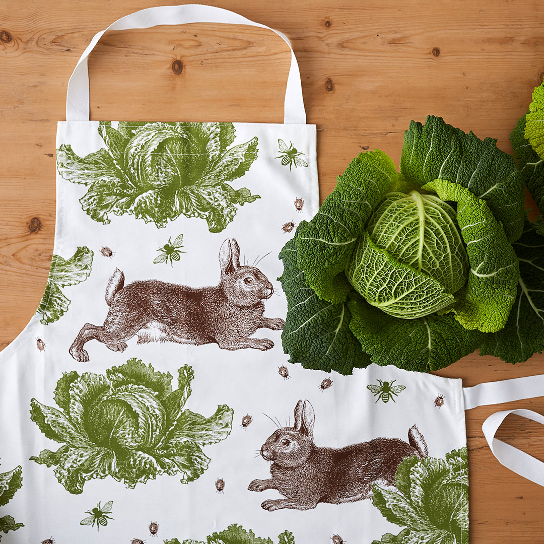 kitchentins - Thornback & Peel cotton apron printed with brown and green rabbit and cabbage design with adjustable neck strap.