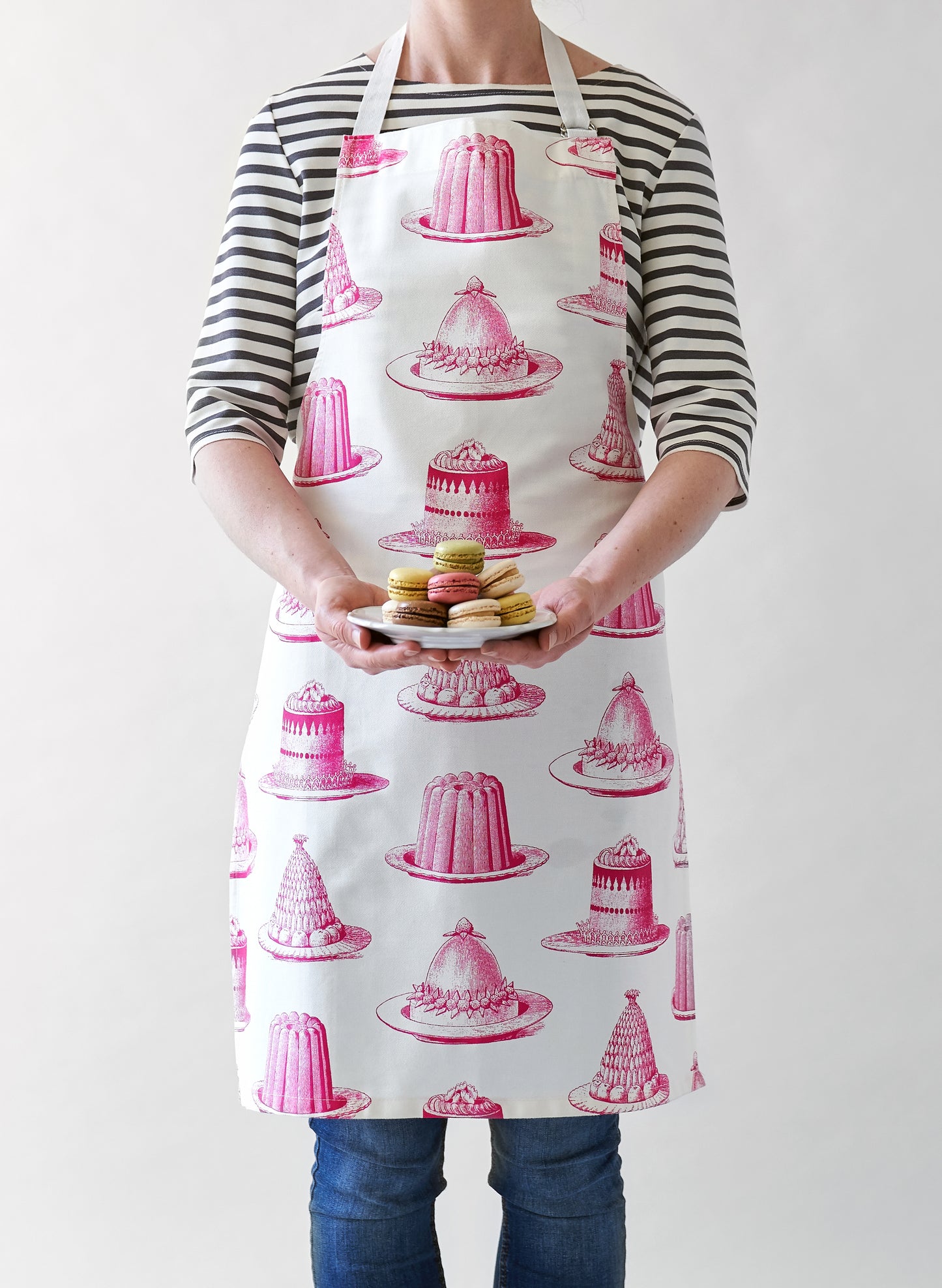 kitchentins - Thornback & Peel cotton apron printed with pink jelly and cake design with adjustable neck strap.